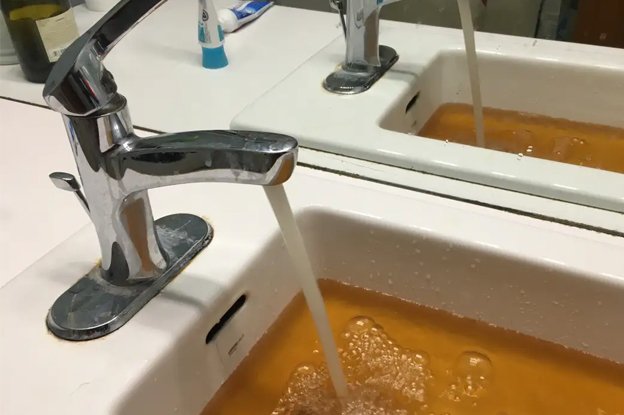 Hard Water a Problem Image of Faucet Running